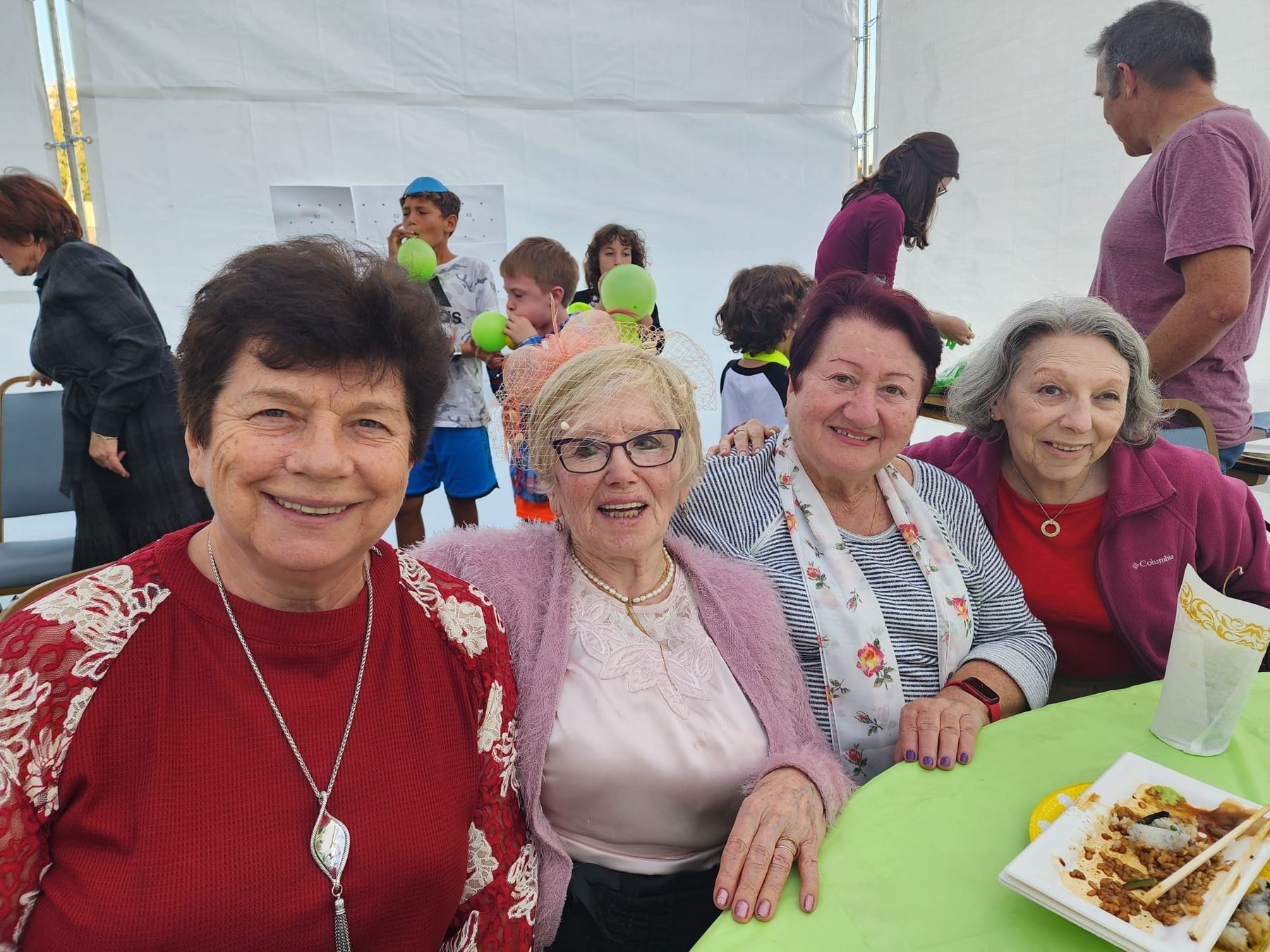 Women smiling at a celebration
