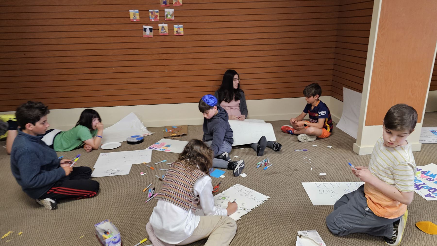 Children drawing on the floor