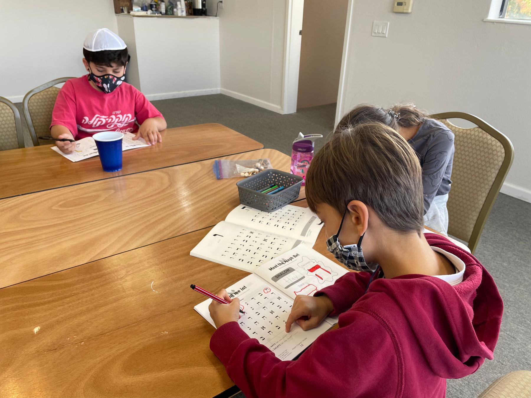 Students at their workbooks